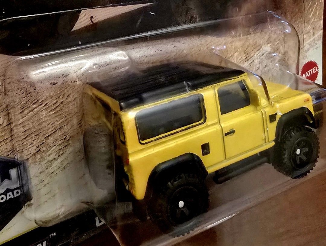 Hot Wheels Premium Land Rover Defender (Category: Vehicle & Diecast Models) located in Manila. Submitted by do_888 (Listing ID 1414502277, Image 2). Description: Hot Wheels Premium Land Rover Defender diecast car. It is part of the Car Culture HW Off-Road series. The car is yellow with a black roof and black wheels. It is a 2/5 model. The packaging is still sealed..