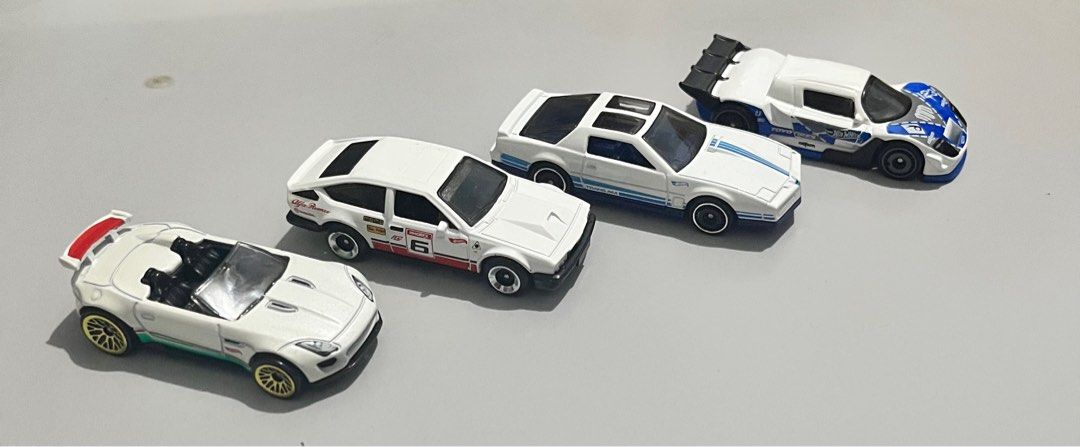 Hot Wheels “White Assorted Cars” (Mattel) (Category: Vehicle & Diecast Models) located in Quezon City. Submitted by pwrproductions (Listing ID 1414589580, Image 2). Description: Includes rare mad mike, pontiac firebird, Alfa Romeo and jaguar convertible (White)..