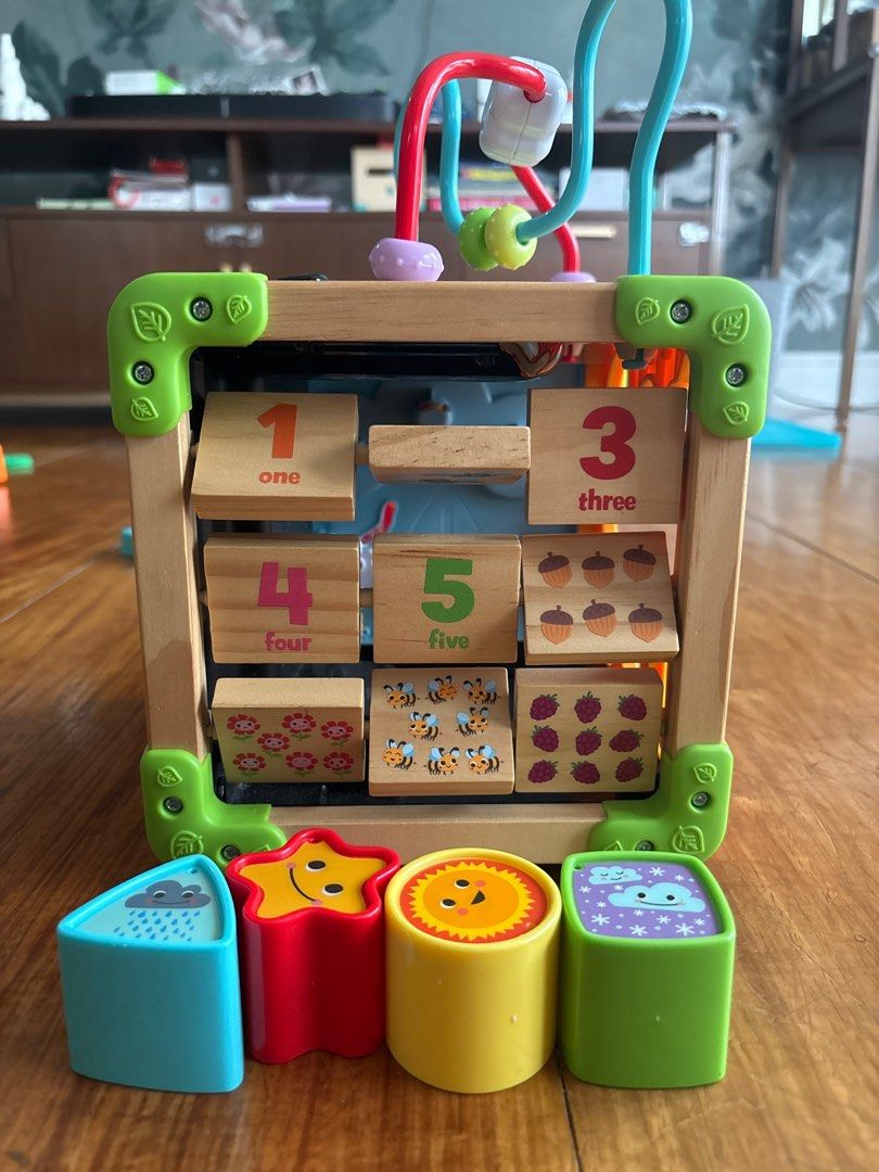 Leap Frog Touch & Learn Activity Cube (Category: Infant Playtime) located in Pasig City. Submitted by logorini (Listing ID 1414508412, Image 2). Description: SRP 4000 Barely used In very good working condition Needs batteries Cellphone sticker a little torn - Multi-activity cube for early learning. - Includes a bead maze, shape sorter, and number blocks. - Features interactive panels with animal illustrations and gears. - Made with a wooden frame