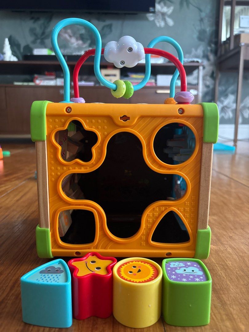 Leap Frog Touch & Learn Activity Cube (Category: Infant Playtime) located in Pasig City. Submitted by logorini (Listing ID 1414508412, Image 3). Description: SRP 4000 Barely used In very good working condition Needs batteries Cellphone sticker a little torn - Multi-activity cube for early learning. - Includes a bead maze, shape sorter, and number blocks. - Features interactive panels with animal illustrations and gears. - Made with a wooden frame