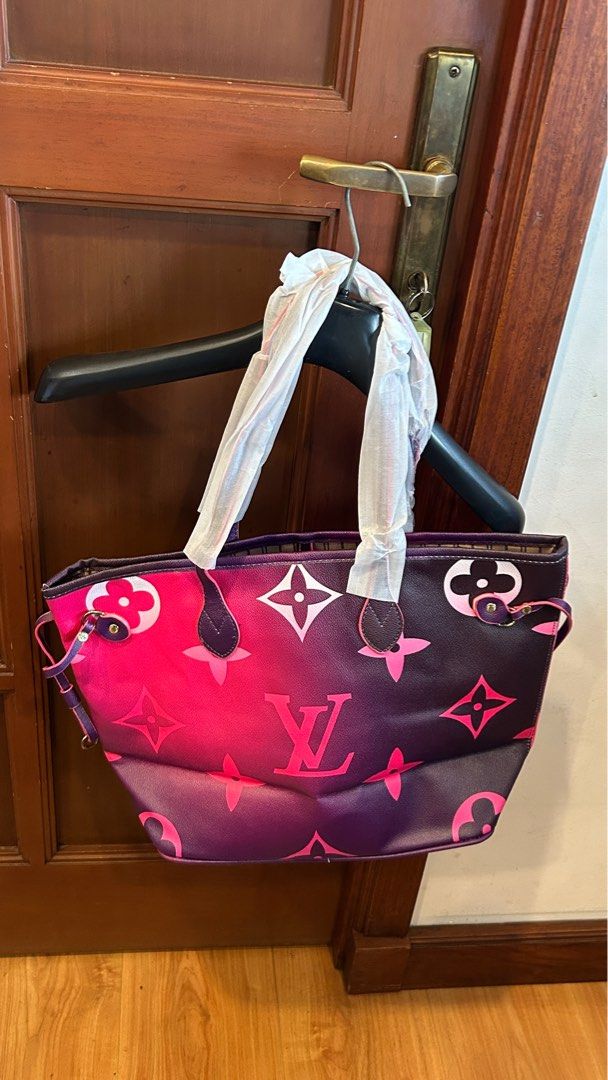 Louis Vuitton Neverfull Tote Bag (Category: Luxury Bags & Wallets) located in Lubao. Submitted by iellahs (Listing ID 1414568519, Image 2). Description: - Louis Vuitton Tote Bag - Eye-catching pink and purple gradient monogram design - Includes a matching pouch - Interior features a stylish striped pattern with the LV logo - Convenient interior zip pocket - Carried with two sturdy handles.