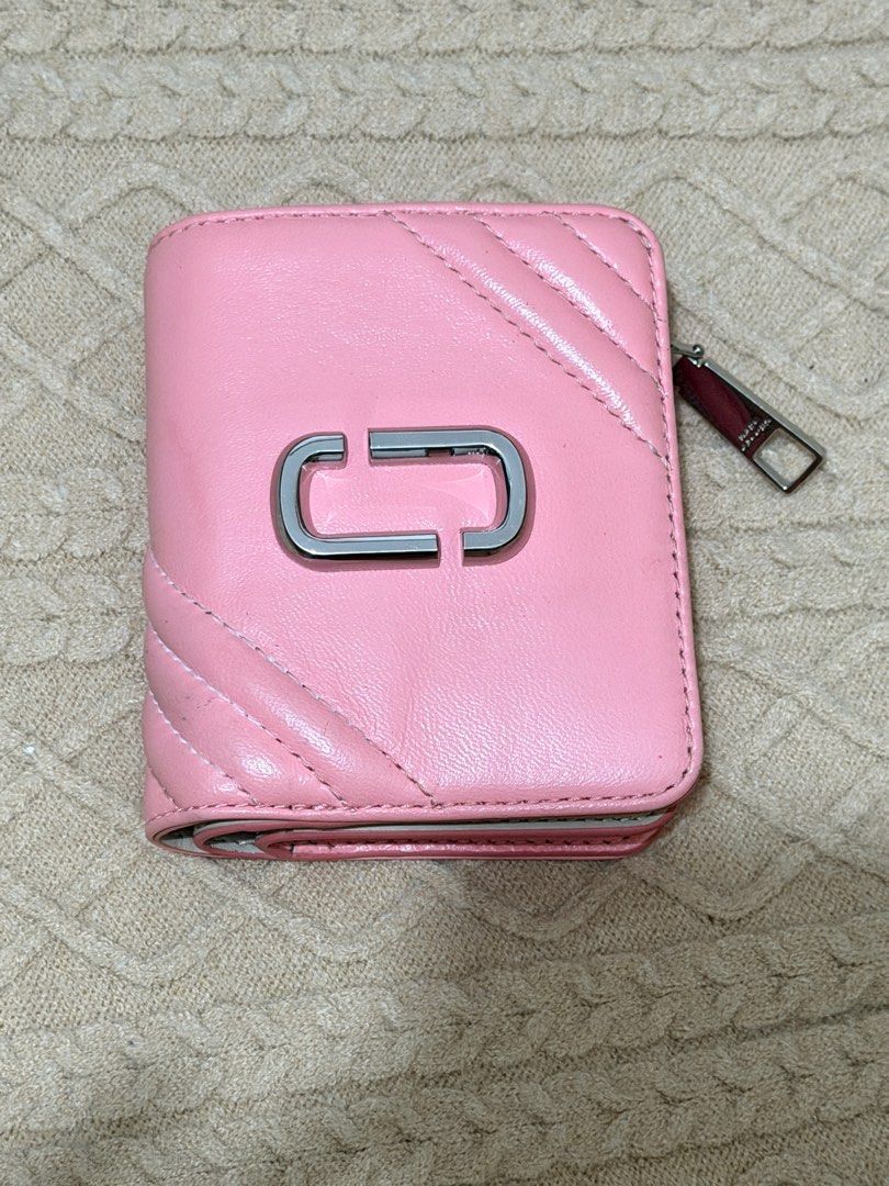 Marc Jacobs Pink Quilted Wallet (Category: Luxury Bags & Wallets) located in San Mateo. Submitted by eunoiaclothingph2.0 (Listing ID 1414581393, Image 2). Description: - Authentic Marc Jacobs The Glam Shot mini compact wallet in quartz pink lamb leather with silver-tone hardware - Pink quilted design - Silver-tone 'J' logo - Multiple card slots - Zippered coin compartment - Light beige interior - Snap and zipper closure - Marc Jacobs logo inside.