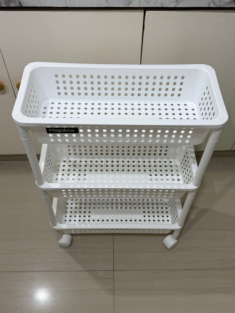Megabox 3-Tier Wide Rolling Cart (Category: Storage Boxes & Baskets) located in Bacoor. Submitted by bbgey (Listing ID 1414466000, Image 3). Description: Good as new! I have 2 units available! Size (cm): L46.2 / W20.5 / H66.5 RFS: No longer needed No issues. Location for pick-up: Las Pinas - Megabox 3-tier rolling cart - Three spacious white baskets - Perforated bottoms for ventilation - Mounted on wheels for easy mobility - Perfect for kitchen, 