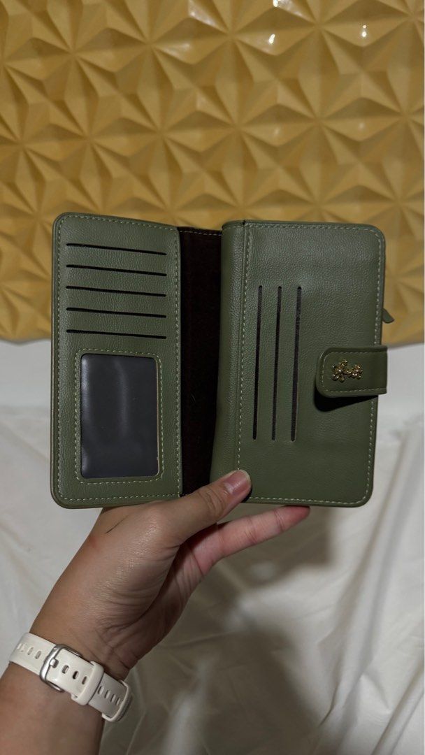 Michaela Wallet - Olive Green (Category: Wallets & Card holders) located in Makati City. Submitted by severusss (Listing ID 1414548749, Image 2). Description: - Olive green Michaela wallet - Multiple card slots - Clear ID window - Zippered compartment - Snap closure - Decorative floral accent - Leather-like material Rfs: stock.