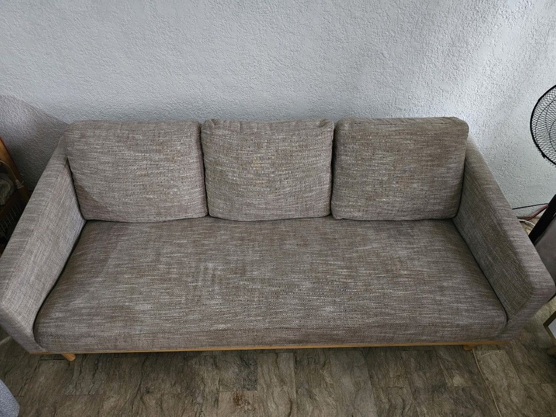 Minimalist 3-Seater Sofa Wooden (Category: Sofas) located in Muntinlupa City. Submitted by janelie (Listing ID 1414524558, Image 3). Description: Selling our 1-2 year old 3-seater fabric sofa with wooden base. Pillows have washable covers. Length: 190cm Width: 53cm Seating height: 37cm Condition: Excellent condition, like new. RFS: Changing the theme of our house Location: sucat paranaque Newly cleaned (vacuum+shampoo+ steam) last Feb 5, 2026:).