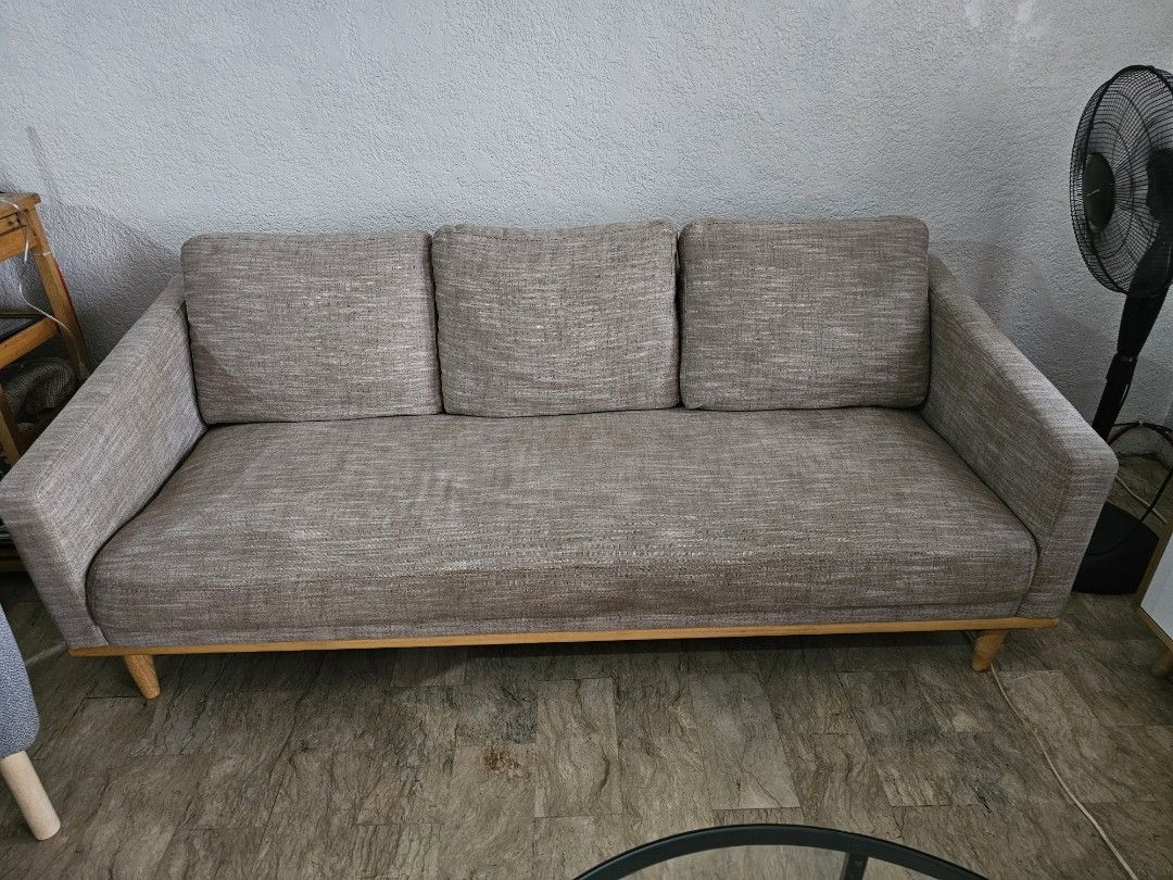 Minimalist 3-Seater Sofa Wooden (Category: Sofas) located in Muntinlupa City. Submitted by janelie (Listing ID 1414524558, Image 2). Description: Selling our 1-2 year old 3-seater fabric sofa with wooden base. Pillows have washable covers. Length: 190cm Width: 53cm Seating height: 37cm Condition: Excellent condition, like new. RFS: Changing the theme of our house Location: sucat paranaque Newly cleaned (vacuum+shampoo+ steam) last Feb 5, 2026:).