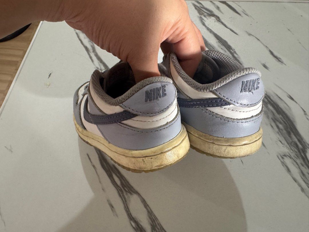 Nike Dunk Low Baby Shoes (Category: Babies & Kids Fashion) located in Quezon City. Submitted by aybidee (Listing ID 1414618882, Image 3). Description: - Nike Dunk Low baby shoes - Grey and white colorway - Nike logo detail - Signs of wear on soles - Laced up and ready to wear.