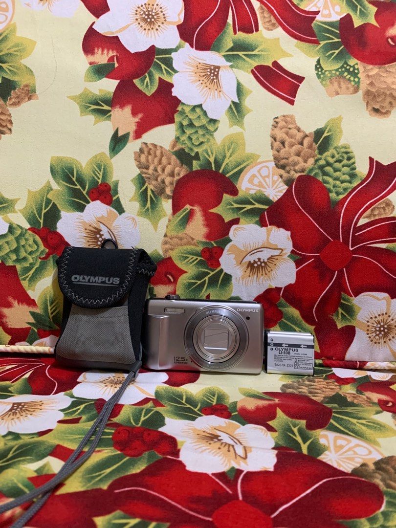 Olympus Digital Camera (Category: Cameras) located in Manila. Submitted by laurelaty51588 (Listing ID 1414528857, Image 2). Description: - Olympus digital camera - 12.5x zoom lens - Includes camera case - Includes battery - Silver color Issue: Black screen RFS: Upgrade.