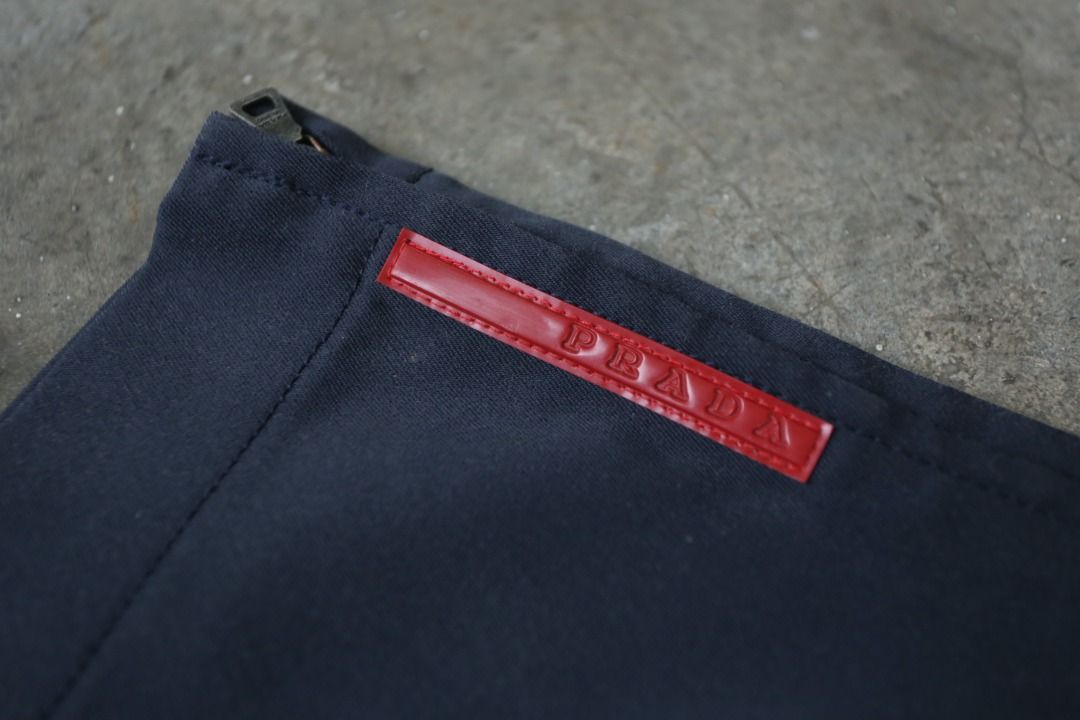 Prada Sport - Technical Trousers (Category: Trousers) located in Manila. Submitted by graymatter_ (Listing ID 1414536558, Image 3). Description: Prada Sport - Technical Trousers Tagged Size: 48 Condition: 9/10 Flaws: Missing Button on Waist Material: Cotton, Altre Fibre Zipper: Riri Made in: Italy Dimensions Waist: 34 Inseam: 30.5 Crotch: 12.5 Thigh: 12 Leg Opening: 9 .
