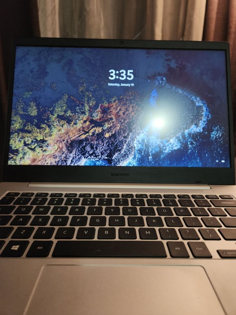 Samsung Galaxy Book Go WiFI (Category: Laptops & Notebooks) located in Malolos. Submitted by tristanabella (Listing ID 1414619606, Image 2). Description: Samsung Galaxy Book Go WiFi Unit Only - Snapdragon 7c Gen 2 - ARM Based Windows 11 - 4 GB RAM - 80% Smooth, scratches on the black bezel at the bottom as shown in the picture - Attached magnetic phone holder at the lid - 100% Functioning screen, keyboard, touchpad, bluetooth, WiFi, etc. RFS: Dec