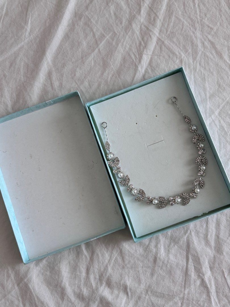 Silver Pearl Headband Hair Accessory (Category: Hair Accessories) located in Quezon City. Submitted by dreamhues (Listing ID 1414495269, Image 1). Description: Silver Pearl Headband Hair Accessory → Never used, was just in storage → Original packaging, comes in a light blue-green gift box → Intricate design, ideal for special events.