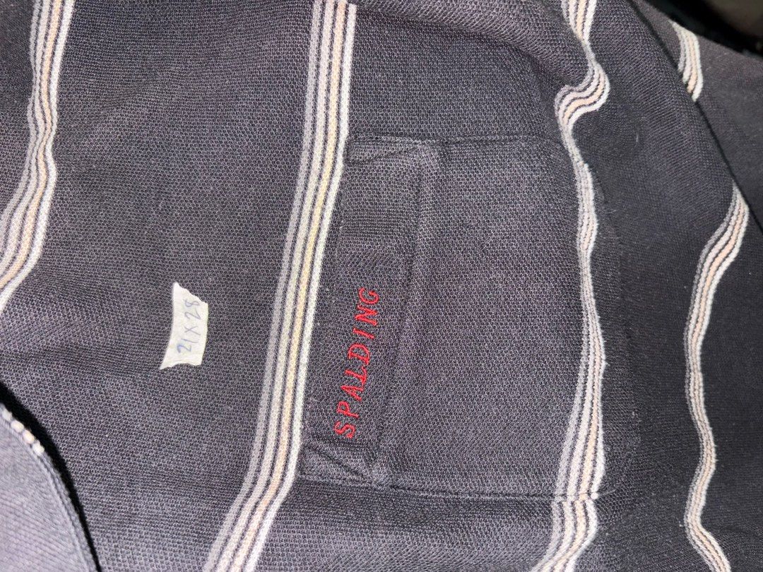 Spalding Striped Polo Shirt (Category: Tshirts & Polo Shirts ) located in Quezon City. Submitted by batch. (Listing ID 1414581373, Image 3). Description: - Spalding black and white striped polo shirt - Features a chest pocket with Spalding logo - Collared neckline - Short sleeves - Relaxed fit - Comfortable fabric - Ideal for casual wear.
