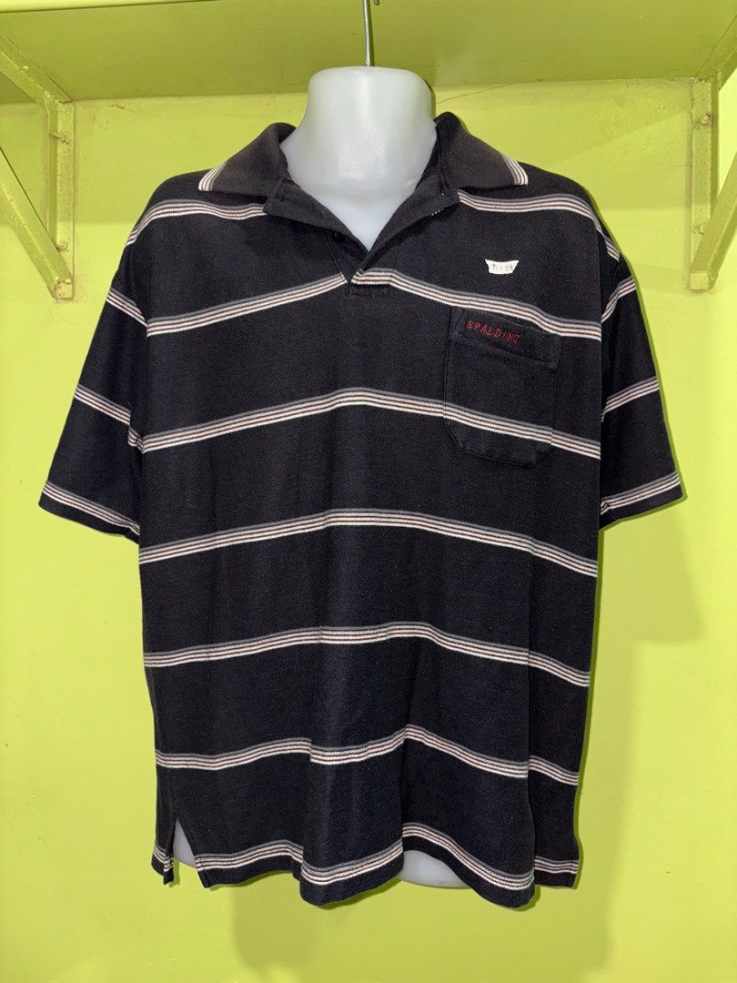 Spalding Striped Polo Shirt (Category: Tshirts & Polo Shirts ) located in Quezon City. Submitted by batch. (Listing ID 1414581373, Image 1). Description: - Spalding black and white striped polo shirt - Features a chest pocket with Spalding logo - Collared neckline - Short sleeves - Relaxed fit - Comfortable fabric - Ideal for casual wear.
