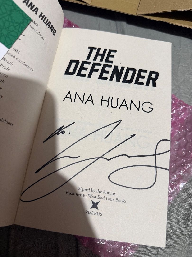 The Defender by Ana Huang - Signed Copy (Category: Storybooks) located in Quezon City. Submitted by lokiandeevee (Listing ID 1414495693, Image 2). Description: Copy of "The Defender" by Ana Huang, Book 2 in the series. It is a signed copy, exclusive to West End Lane Books. The cover features a blue and white design with the title prominently displayed. The author's name is also visible on the cover..