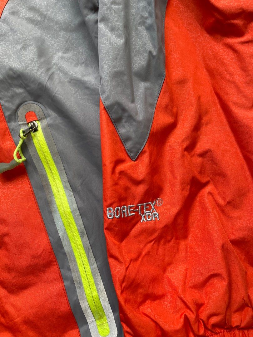 The North Face Summit Series Gore-Tex Jacket XL (Category: Coats, Jackets and Outerwear) located in Manila. Submitted by deadloxarn23439 (Listing ID 1414577833, Image 2). Description: Width- 22 Length- 26 - The North Face Summit Series jacket - Color: Orange and Grey - Size: XL - Features Gore-Tex XCR shell - Zip-up front - Hood included - Summit Series logo on sleeve - North Face logo on chest - Made in China.