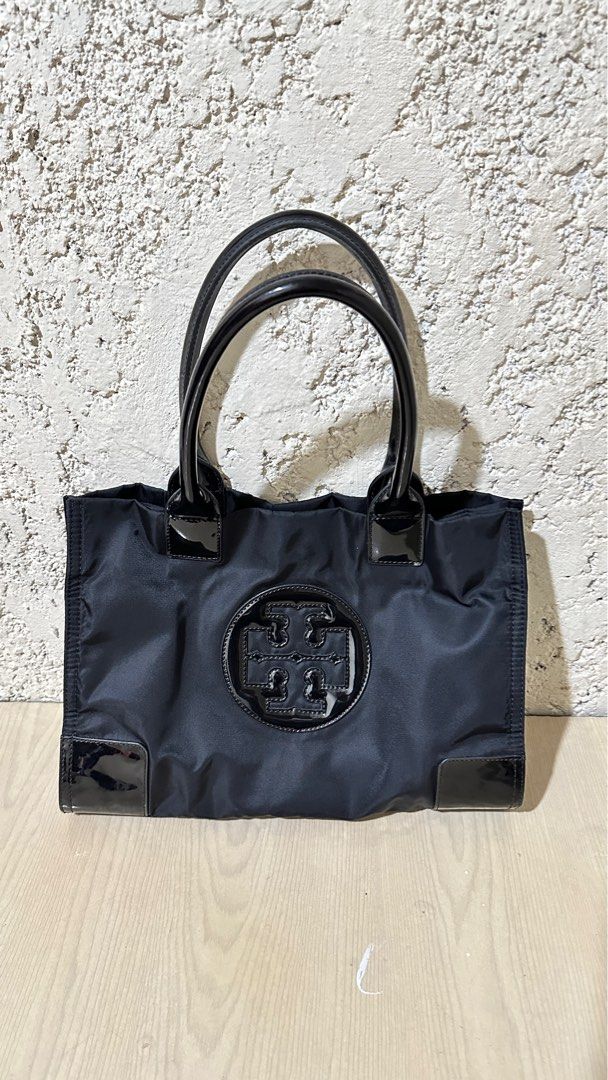 Authentic Tory Burch Ella Nylon Tote Bag Small (Category: Luxury Bags & Wallets) located in Manila. Submitted by pamsayat (Listing ID 1414584682, Image 1). Description: Size: Small 13 inches x 9.5 inches Condition: • Intact handle rubber linings • Clean interior, ready to use Issues: • Minimal scratches • Normal signs of use Reminders: • Last price is already posted and non-negotiable. • No return or exchange. All sales are final. Please ensure t