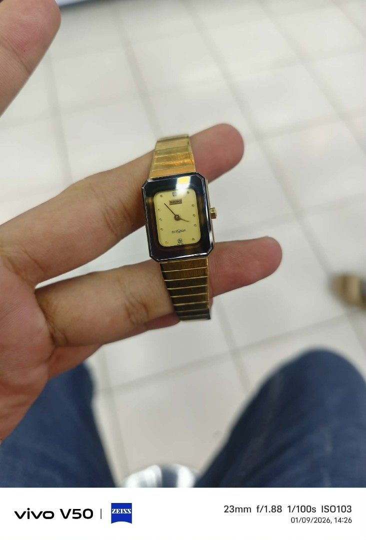 Vintage rado Gold Watch (Category: Women's Watches) located in Zamboanga. Submitted by sarahjaneatari (Listing ID 1414499448, Image 2). Description: - Vintage rado diastar gold-toned watch - Rectangular face with gold dial - Black border - Gold-toned metal link band - Silver back.