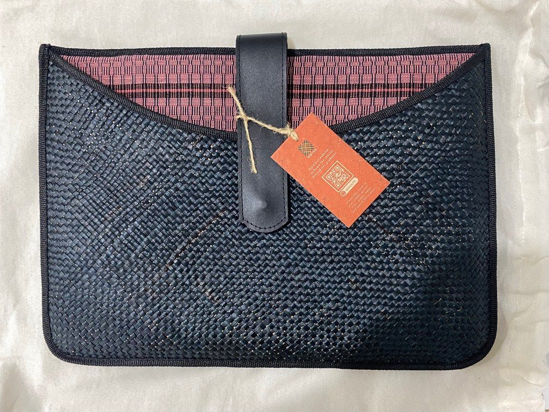 Woven Suklob Laptop/Ipad Sleeve (Category: Laptop Bags & Sleeves) located in Cavite. Submitted by lovedbyniz (Listing ID 1414567038, Image 1). Description: • Brand new with tag and original dust bag. • Original Price: ₱2,399 • Made from handwoven banig • Inner fabric handwoven by local crafts communities • Flap made out of genuine local leather • Magnetic snap • Interior padded with foam • Slot for laptop/iPad/tablet (fits 13-in) .