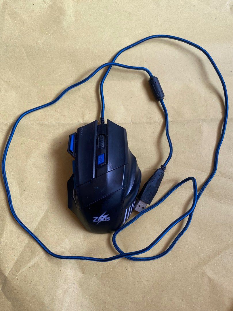 Zeus Gaming Mouse (Category: Mouse & Mousepads) located in Cebu City. Submitted by ubecanything4sale (Listing ID 1414601090, Image 1). Description: - Zeus gaming mouse - Blue braided cable - DPI adjustment buttons - Turbo button - Compatible with Windows 2000, XP, Vista, Win7, 8/10 - 5V, 100mA - Made in China.