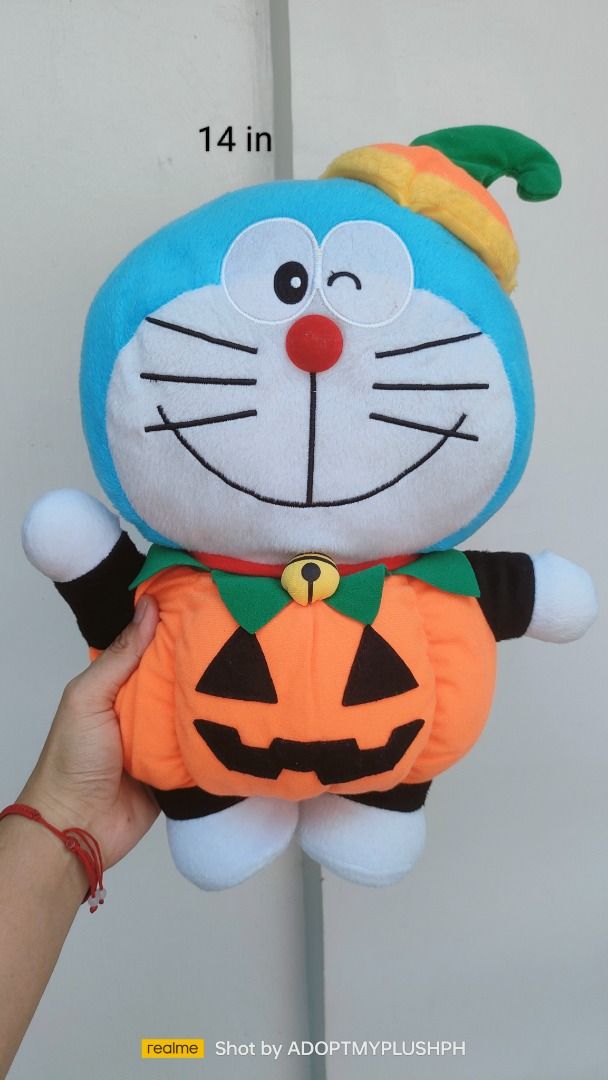 14" Doraemon Halloween-themed plush (Category: Plushies & Soft Toys) located in Taguig. Submitted by adopt.my.plush.ph (Listing ID 1465306724, Image 3). Description: 14" Halloween-themed Doraemon plush toy wearing a pumpkin costume and a matching hat *as is, toy label was cut-off/removed.