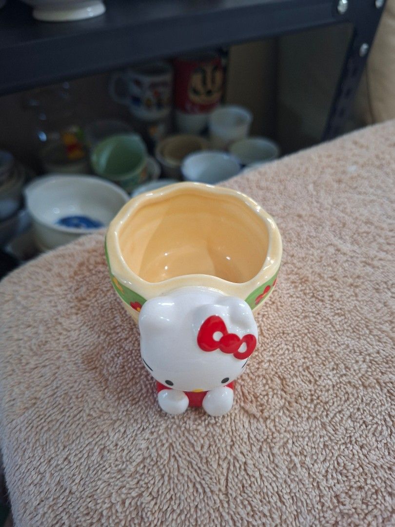 2003 Sanrio Hello Kitty Ceramic Basket (Category: Everything Else Others) located in Consolacion. Submitted by luxekerei (Listing ID 1465176880, Image 2). Description: - a vintage 2003 Sanrio Hello Kitty ceramic basket or small trinket/succulent pot featuring a 3D Hello Kitty figure attached to the side..