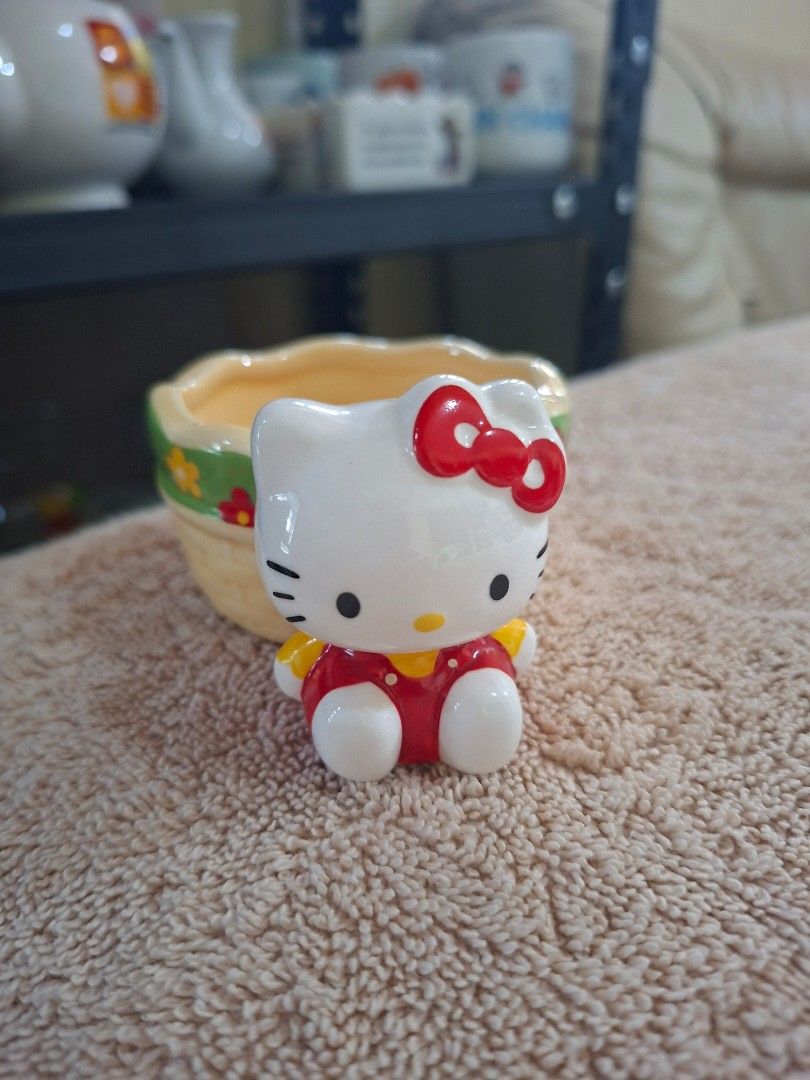 2003 Sanrio Hello Kitty Ceramic Basket (Category: Everything Else Others) located in Consolacion. Submitted by luxekerei (Listing ID 1465176880, Image 1). Description: - a vintage 2003 Sanrio Hello Kitty ceramic basket or small trinket/succulent pot featuring a 3D Hello Kitty figure attached to the side..