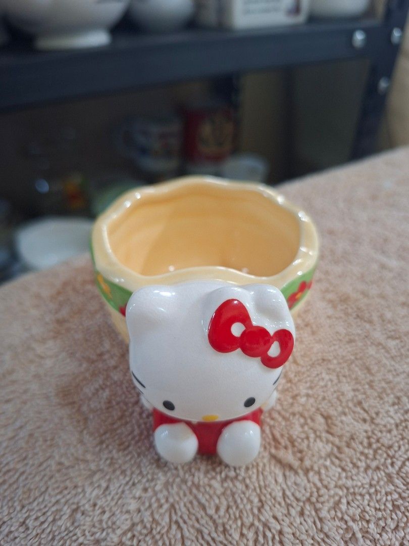 2003 Sanrio Hello Kitty Ceramic Basket (Category: Everything Else Others) located in Consolacion. Submitted by luxekerei (Listing ID 1465176880, Image 3). Description: - a vintage 2003 Sanrio Hello Kitty ceramic basket or small trinket/succulent pot featuring a 3D Hello Kitty figure attached to the side..
