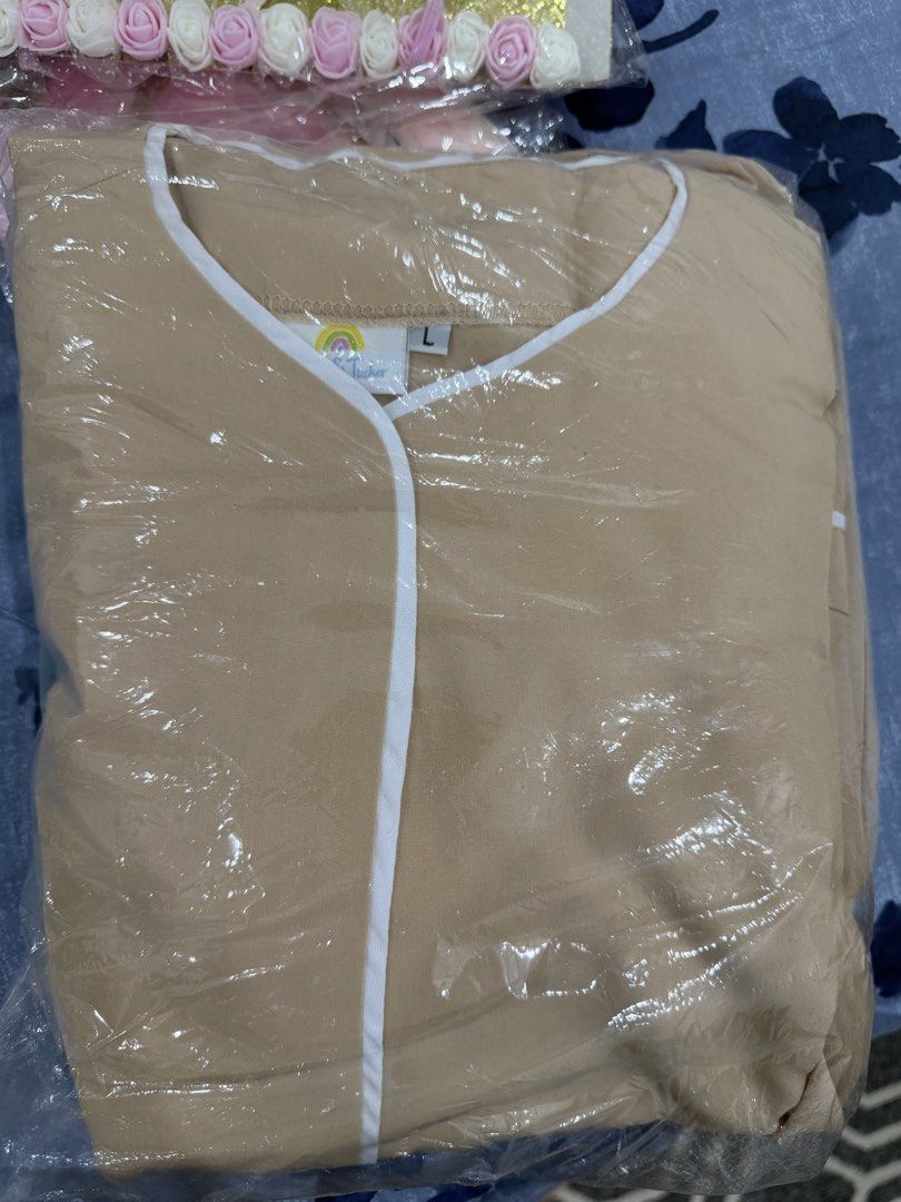 2 sets Lily & Tucker Beige Scrub Top Size L (Category: Blouses) located in Talisay. Submitted by itslucym (Listing ID 1465338033, Image 2). Description: - Brand: Lily & Tucker - Color: Beige with white V-neck trim - Size: Large - Condition: Brand new, still sealed in original plastic packaging - Fabric: Clean with a soft finish - Perfect comfortable addition to your work wardrobe - Two sets - Free extra green pants.