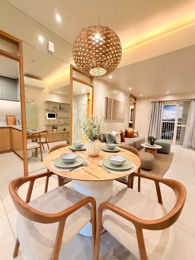 2BEDROOM MARCO POLO (Category: Apartments & Condos) located in Cebu City. Submitted by cebuproperty__400 (Listing ID 1465222425, Image 1). Description: Round wooden dining table paired with four upholstered armchairs. Light wood grain top with a sturdy cylindrical base. Curved wooden armrests and soft fabric seats on the chairs. Great set for a cozy dining area or apartment setup..