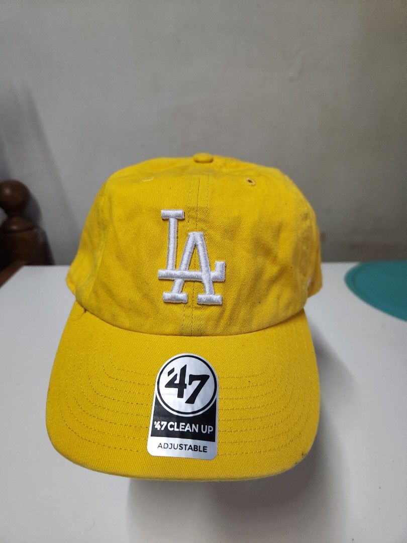 '47 Brand LA Dodgers Yellow Clean Up Adjustable Cap (Category: Caps & Hats) located in Quezon City. Submitted by amber___18 (Listing ID 1465347542, Image 1). Description: - Brand: '47 Clean Up - Team: LA Dodgers - Color: Bright yellow with white embroidered logo - Condition: Brand new, never worn, with original tags and brim sticker - Fit: Adjustable strap with metal slider.