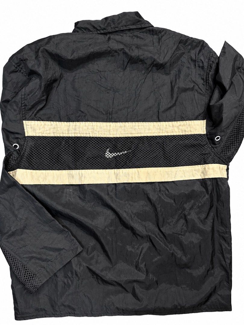 90s Vintage Nike USA Nylon Jacket (Category: Coats, Jackets and Outerwear) located in Manila. Submitted by safeowl.b6dbb0 (Listing ID 1465367392, Image 3). Description: Black Nike USA windbreaker jacket with mesh paneling on sleeves and back. Classic cursive Nike USA embroidery on the chest. Full zip closure with collar and side zip pockets. Vintage inner label with RN and CA numbers. Lightweight outer shell. Good streetwear staple. All complete 