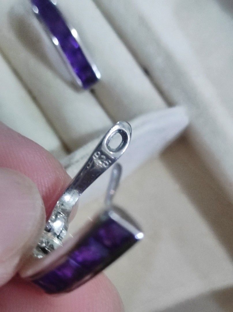 925 Silver Amethyst Channel Set Hoop Earrings (Category: Earrings) located in Cavite. Submitted by noblepenguin_6c8662 (Listing ID 1465184016, Image 3). Description: - Material: Genuine 925 Sterling Silver (stamped on clasp) - Gemstone: Channel-set princess-cut purple amethyst stones with vibrant color - Closure: Secure and smooth-working snap closure - Design: Solid, well-crafted everyday jewelry piece that catches the light nicely.