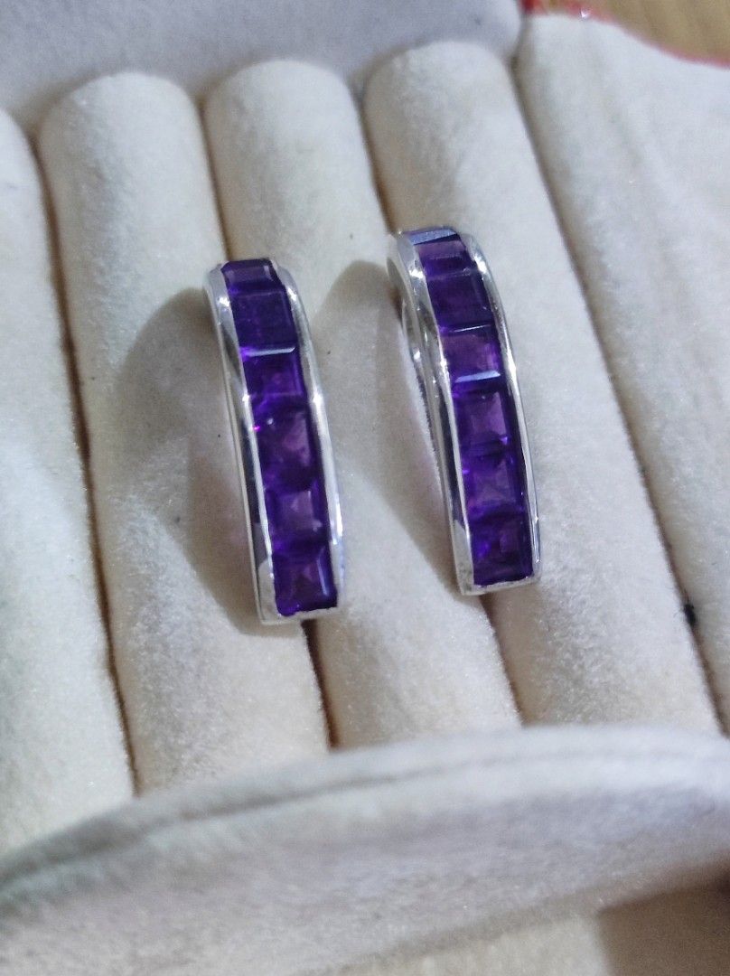 925 Silver Amethyst Channel Set Hoop Earrings (Category: Earrings) located in Cavite. Submitted by noblepenguin_6c8662 (Listing ID 1465184016, Image 2). Description: - Material: Genuine 925 Sterling Silver (stamped on clasp) - Gemstone: Channel-set princess-cut purple amethyst stones with vibrant color - Closure: Secure and smooth-working snap closure - Design: Solid, well-crafted everyday jewelry piece that catches the light nicely.