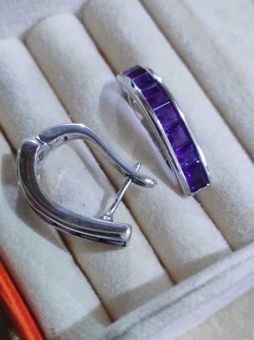 925 Silver Amethyst Channel Set Hoop Earrings (Category: Earrings) located in Cavite. Submitted by noblepenguin_6c8662 (Listing ID 1465184016, Image 1). Description: - Material: Genuine 925 Sterling Silver (stamped on clasp) - Gemstone: Channel-set princess-cut purple amethyst stones with vibrant color - Closure: Secure and smooth-working snap closure - Design: Solid, well-crafted everyday jewelry piece that catches the light nicely.