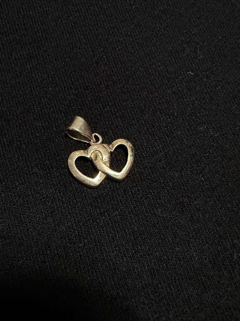 925 Silver Interlocking Double Heart Pendant (Category: Necklaces) located in Abucay. Submitted by thrifty.picked (Listing ID 1465359379, Image 1). Description: - Material: Genuine 925 sterling silver with official hallmark stamp - Design: Elegant interlocking double open hearts with a polished finish - Versatile: Small bail fits most standard necklace chains - Style: Simple, lightweight, and perfect for everyday wear - Ready to gift or add to yo