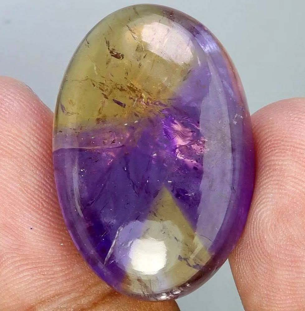 💯 Natural AMETRINE loose (Category: Precious Stones) located in Kawit. Submitted by authentic_gemstones_byalton (Listing ID 1465327932, Image 1). Description: AVAILABLE ❗ 💯 NATURAL AMETRINE LOOSE ▪️48.0 carats ▪️30.0x20.0x10.0(mm) dimension ▪️Oval cabochon ▪️SI (clarity) (superb natural inclusions) ▪️Unheated/untreated ▪️7.0 (hardness) ▪️(Brazil) origin ▪️100% brand new item #gemstones #ametrine #AuthenticGemstonesbyALTON.