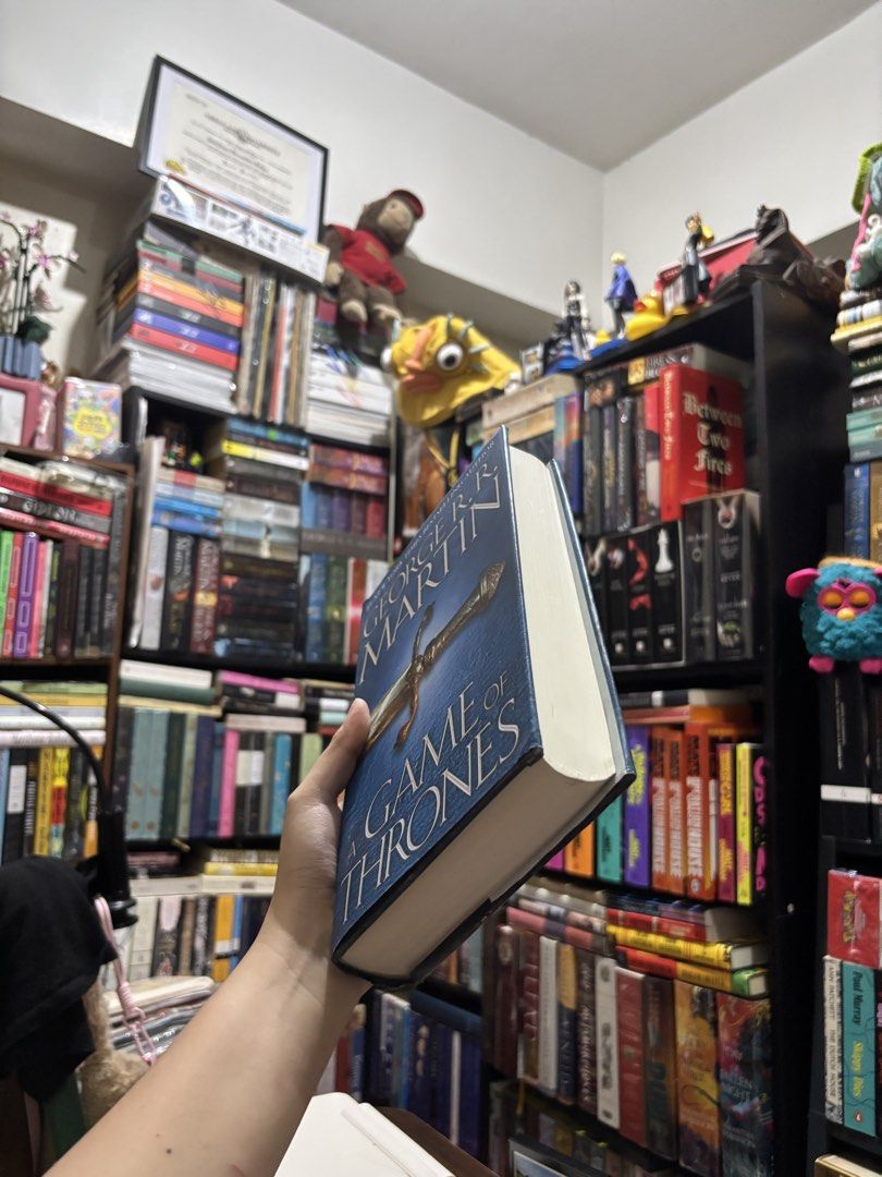 A Game of Thrones Hardcover (Category: Storybooks) located in Manila. Submitted by paatuhod (Listing ID 1465289666, Image 2). Description: Onhand, please see condition in photos. Never read, no foxing. Library copy. Also open for trade to A Clash of Kings Hardcover! MoP: GCash MoD: Grab/Lala, or LBC only (shipping from Katipunan, QC).