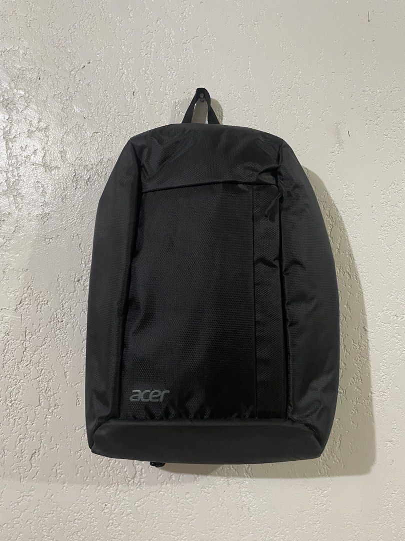 ACER Laptop Backpack Grey Inner Compartment (Category: Backpacks) located in Talisay. Submitted by mrjannchristian (Listing ID 1465355416, Image 1). Description: - Authentic grey Acer backpack - Stylish interior lining featuring a branded repeating logo pattern - Multiple internal pockets and slip compartments for easy organization - Durable black strap for tumbler inside - Manufacture date: July 2024 (Made in China) - Ideal for school, work, or 