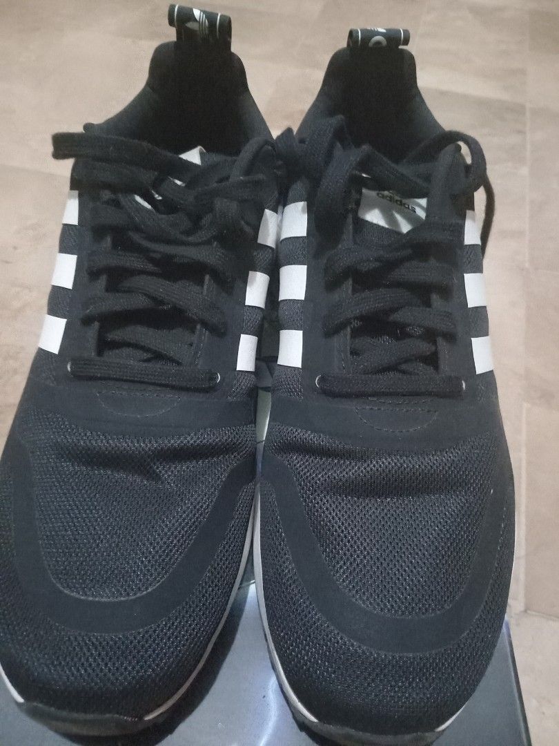 Adidas Black and White Sneakers (Category: Sneakers) located in Muntinlupa City. Submitted by mellowsmom (Listing ID 1465197367, Image 2). Description: - Brand: Adidas - Color: Classic Black and White - Upper: Breathable mesh material for all-day comfort - Design: Iconic three stripes with heel pull tab and branding - Sole: White chunky midsole with unique patterned detailing - Laces: Black laces - Condition: Brand new with box - Perfect for dail