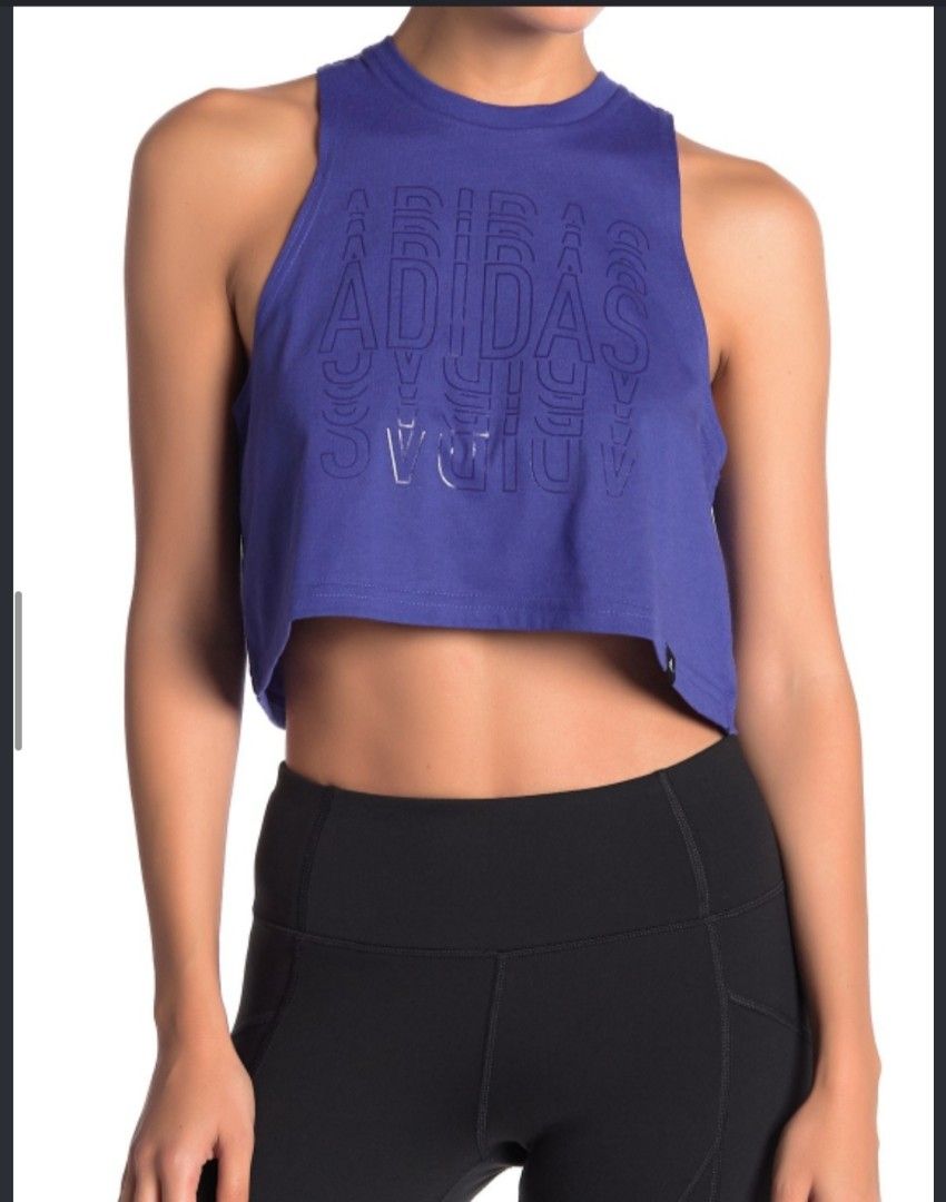 Adidas Blue Crop Tank Top (Category: Activewear) located in Cebu City. Submitted by deadjay84 (Listing ID 1465378750, Image 2). Description: - Brand: Adidas -Medium - Color: Blue with white outline logo and light grey collar trim - Style: Crop tank top with crew neck and dropped armholes - Material: Soft cotton jersey for maximum comfort - Details: Small black Adidas logo tag on bottom right hem - Ideal for: Gym workouts, runs, and casual streetw