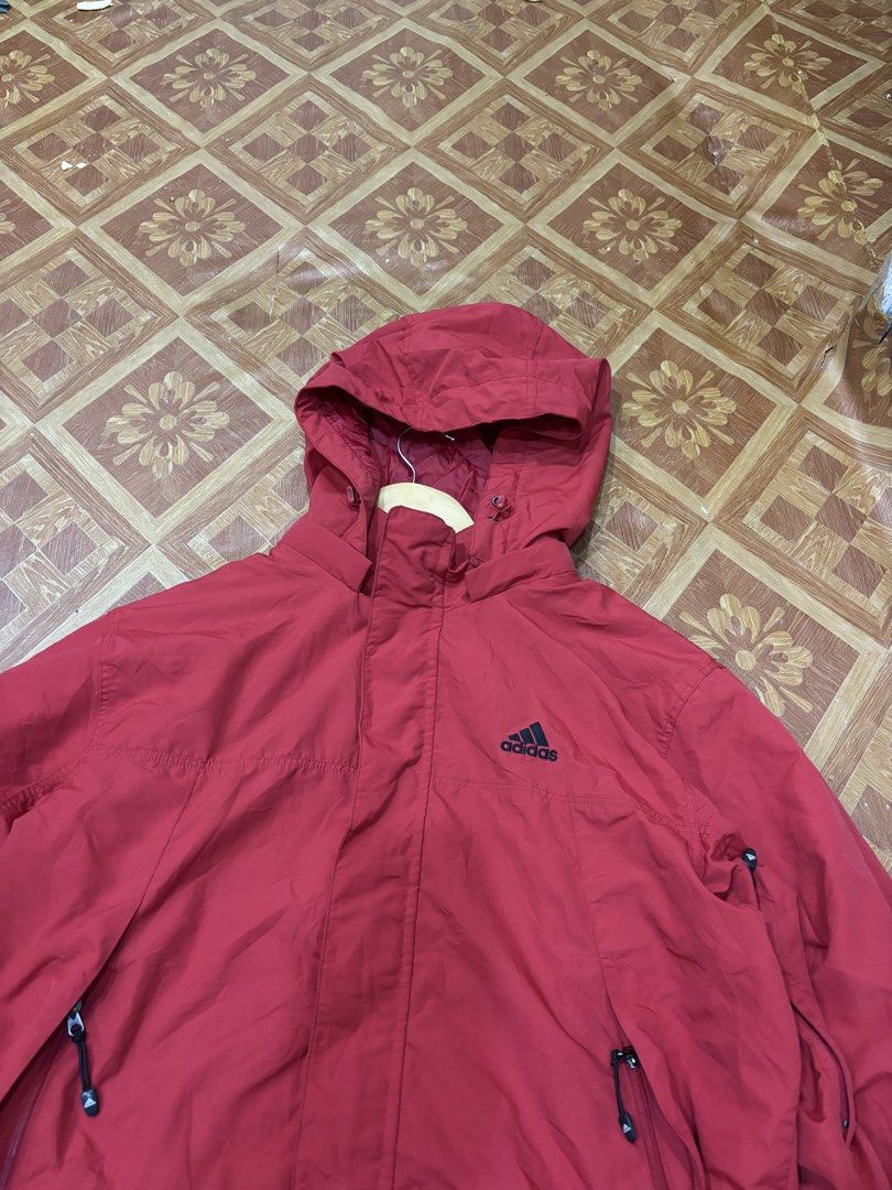 Adidas Red Windbreaker Jacket Size 100 (Category: Coats, Jackets and Outerwear) located in Manila. Submitted by noribrahim.20 (Listing ID 1465280542, Image 2). Description: - Brand: Adidas - Color: Vibrant Red - Size: 100 (Made in Korea) - Material: 100% Polyester (inner and outer) - Features: Built-in hood, front zipper with snap buttons, and zippered side pockets - Condition: Great and clean condition - Perfect lightweight layer for wind and co
