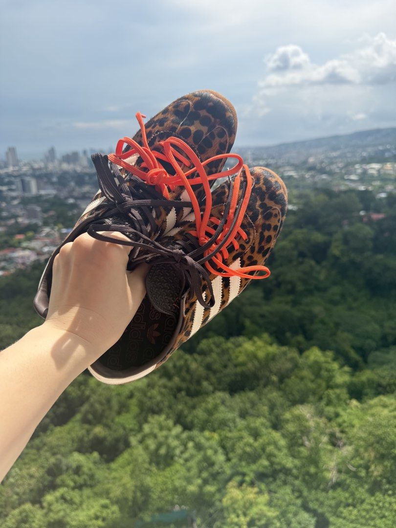 Adidas SL 72 Animal Print Leopard (Category: Sneakers) located in Cebu City. Submitted by irinaivyj (Listing ID 1465213306, Image 2). Description: - Brand: Adidas - Design: Bold leopard animal print with white leather three stripes - Sole: Chunky textured sole with stylish red trim detail - Laces: Includes both standard brown laces and extra bright orange laces - Details: Branded tongue and heel tab - Condition/Style: Distinctive statement pair, 
