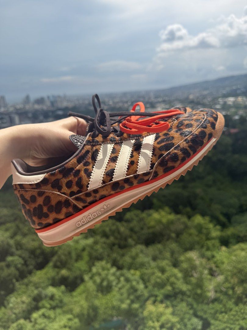 Adidas SL 72 Animal Print Leopard (Category: Sneakers) located in Cebu City. Submitted by irinaivyj (Listing ID 1465213306, Image 1). Description: - Brand: Adidas - Design: Bold leopard animal print with white leather three stripes - Sole: Chunky textured sole with stylish red trim detail - Laces: Includes both standard brown laces and extra bright orange laces - Details: Branded tongue and heel tab - Condition/Style: Distinctive statement pair, 