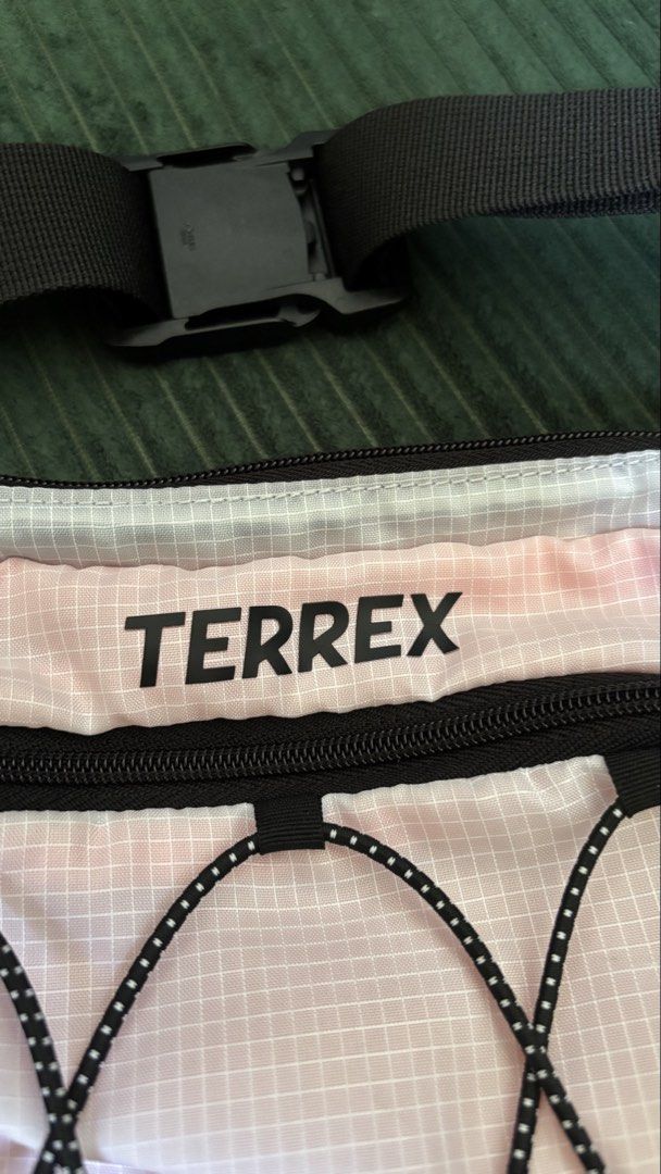 Adidas Terrex Multi Waist Pack (Category: Sling Bags) located in San Pablo. Submitted by alem12 (Listing ID 1465199047, Image 2). Description: - Brand: Adidas Terrex - Model: Multi Waist Pack - 2.5 Liters, 28cm x 14cm - Condition: Brand new with original tags - Features: Secure zippered main compartment, front bungee cord system for extra storage, and an adjustable strap with a quick-release buckle - Ideal for: Hiking, traveling, outdoor activiti