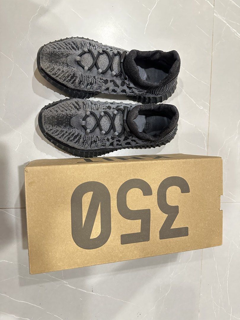 Adidas Yeezy Boost 350 V2 CMPCT Slate Carbon (Category: Sneakers) located in Talisay. Submitted by itslucym (Listing ID 1465342719, Image 2). Description: - Brand: Adidas Yeezy Boost 350 V2 CMPCT - Colorway: Slate Carbon (Grey/Black) - Features: Knit upper, bungee speed lacing, and Boost midsole cushioning - Inclusion: Original shoe box included - Condition: Moderate wear on outsoles and upper knit; still has plenty of life left for daily wear - 