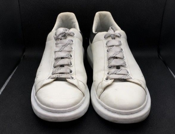 Alexander McQueen Elgard Sneaker White Black (Category: Sneakers) located in Batangas. Submitted by curatedluxxe88 (Listing ID 1465346786, Image 2). Description: - Brand: Alexander McQueen Elgard size 10 - Color: White leather with contrasting black heel counter and gold logo - Sole: Chunky rubber platform sole - Laces: Includes patterned grey laces - Condition: Normal signs of wear on uppers and soles; structure remains very solid - Style: Iconi