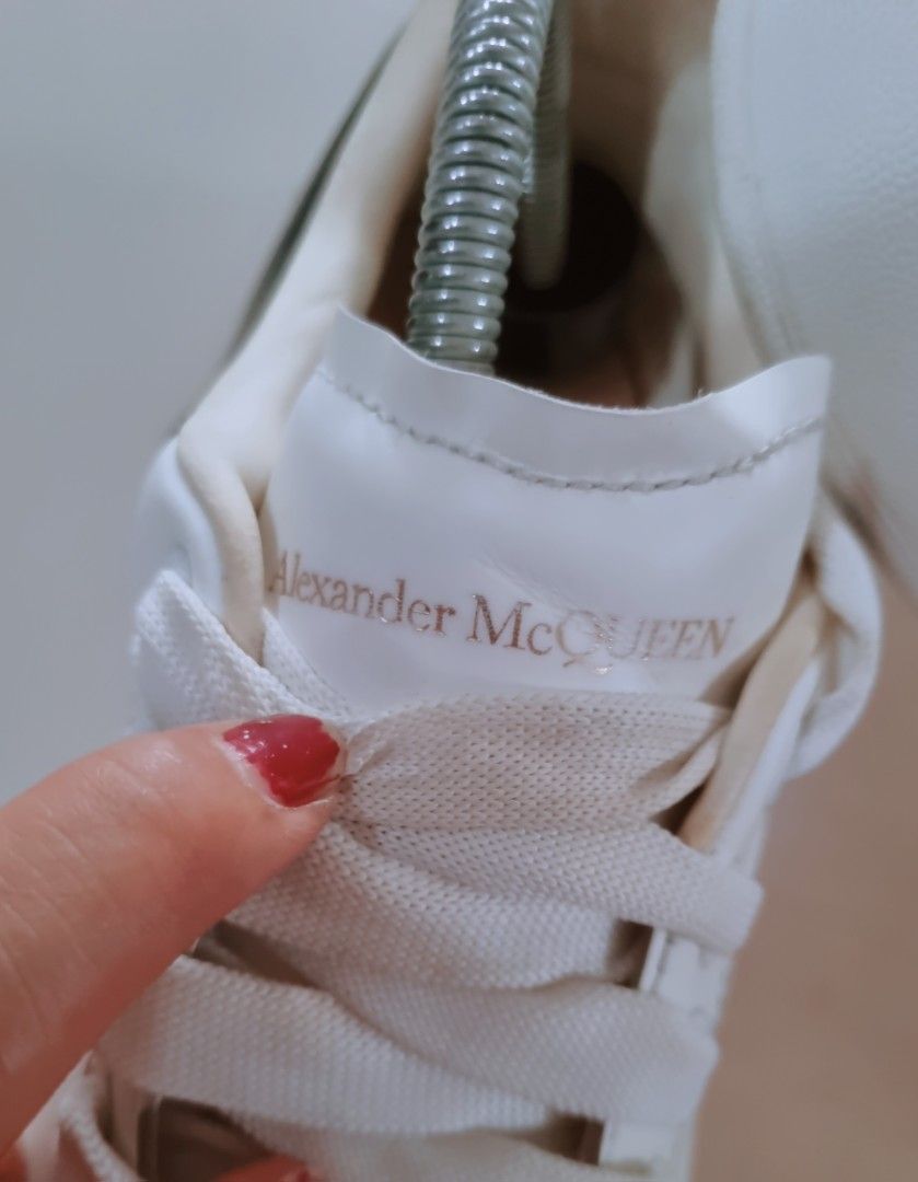 Alexander McQueen Oversized Sneaker White Black (Category: Sneakers & Footwear) located in Danao, Cebu. Submitted by CaxeCart (Listing ID 1465226862, Image 2). Description: - Authentic Alexander McQueen oversized sneakers - Colorway: White leather with black heel counters - Classic chunky rubber soles and wide white laces - Signature gold foil branding on tongue and heel tab - Includes original box - Condition: Minor scuffs on black leather panel