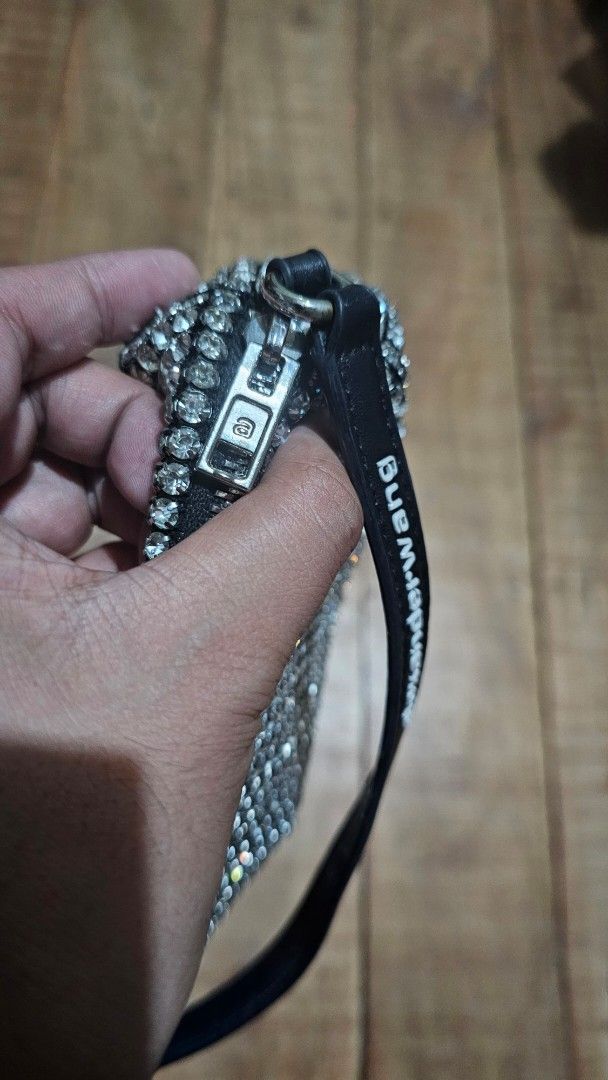 Alexander Wang Rhinestone Handbag (Category: Luxury Bags & Wallets) located in Kibawe. Submitted by Thrift_ni_Babac (Listing ID 1465224640, Image 3). Description: - Brand: Alexander Wang - Color: Black and silver with all-over sparkling crystals - Strap: Black leather shoulder strap featuring white logo text - Closure: Zip top with custom hardware - Interior: Black fabric lining with New York branded patch - Ideal for: Nights out, dinners, partie