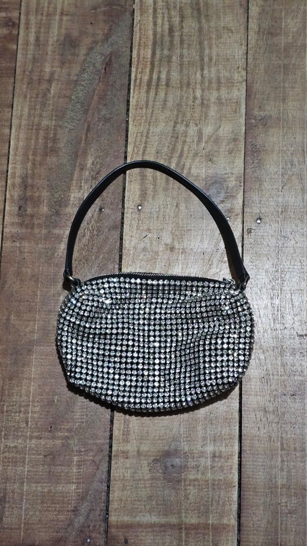 Alexander Wang Rhinestone Handbag (Category: Luxury Bags & Wallets) located in Kibawe. Submitted by Thrift_ni_Babac (Listing ID 1465224640, Image 1). Description: - Brand: Alexander Wang - Color: Black and silver with all-over sparkling crystals - Strap: Black leather shoulder strap featuring white logo text - Closure: Zip top with custom hardware - Interior: Black fabric lining with New York branded patch - Ideal for: Nights out, dinners, partie