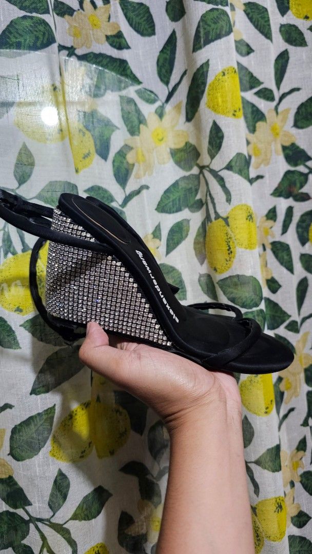 Alexander Wang Rhinestone Wedge Sandals (Category: Sandals) located in Kibawe. Submitted by Thrift_ni_Babac (Listing ID 1465224862, Image 3). Description: - Brand: Alexander Wang - Style: Black wedge sandals with rhinestones along the wedge heel - Size: 37 (marked on sole) - Features: Classic open toe design, slim front strap, and ankle strap with buckle closure - Sole: Vero Cuio leather sole with minor signs of previous wear - Condition: Great p